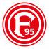 Logo Fortuna Düsseldorf Eine Gruppe von acht Personen steht lächelnd vor einer weißen Wand und hält ein großes Collage-Bild mit vielen kleinen Fotos. Die Personen sind unterschiedlich gekleidet, teils formell, teils leger.